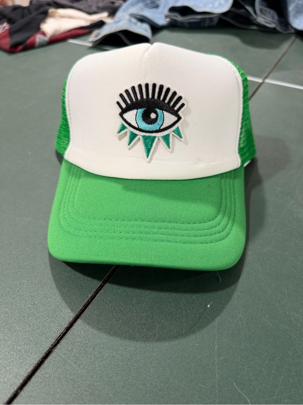 Green and White Eye Patch Trucker Hat